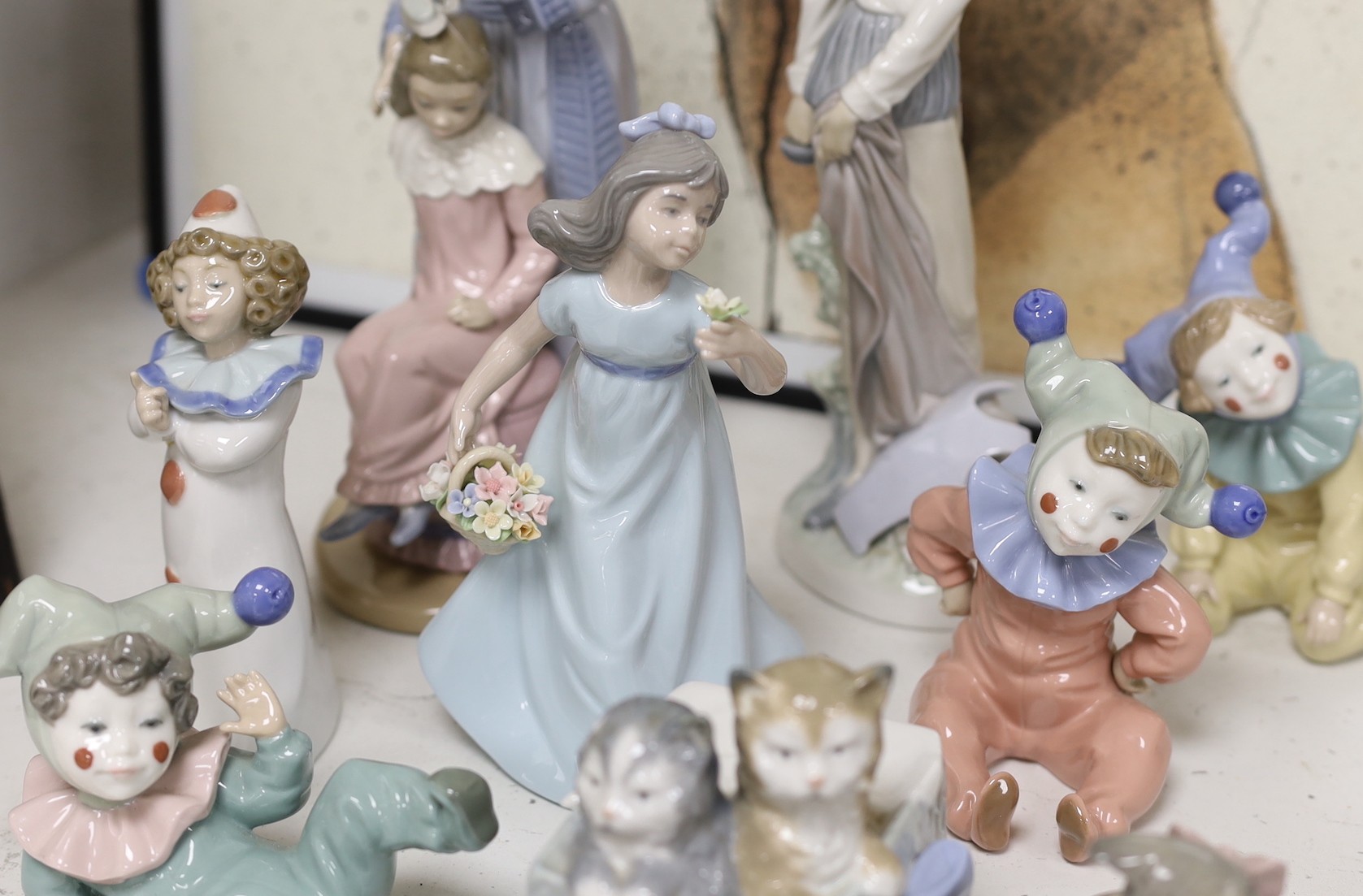 Nine Lladro and Nao figural and animal models, tallest 30cms high